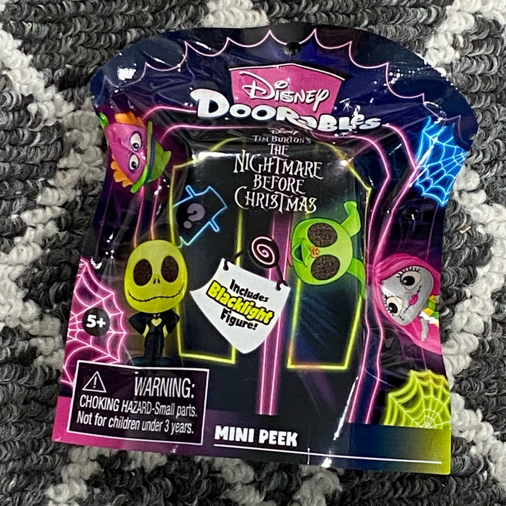 Doorables Nightmare Before Christmas Blacklight Mini Peek figure.